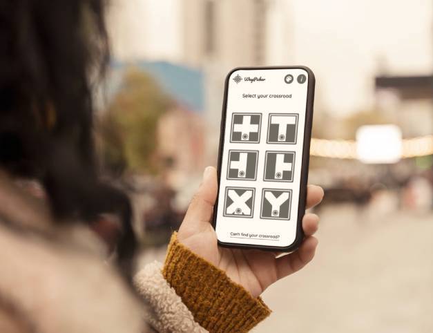 Woman holding phone with WayPicker app